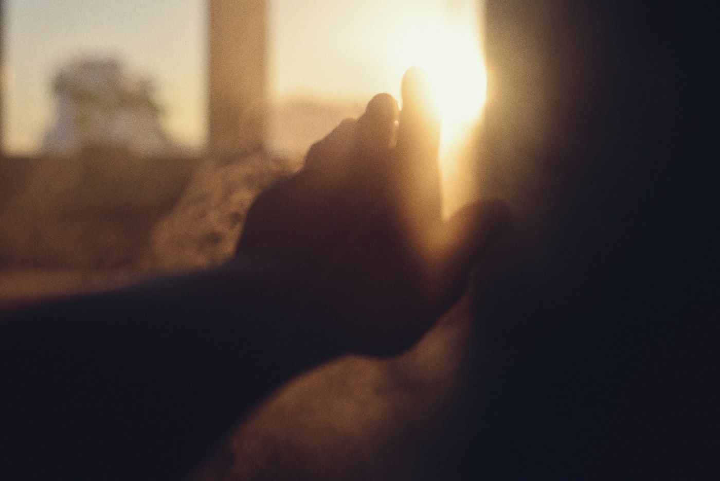 Open hands in sunlight, suggesting relief and progress